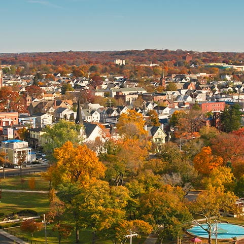 Overview of a charming town with colorful buildings and cobblestone streets.