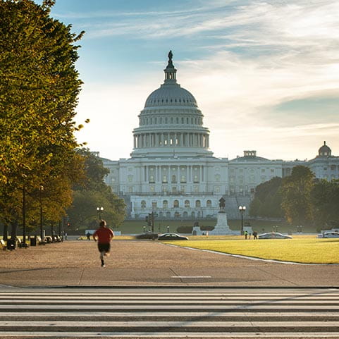 The United States Capitol Building in Washington, DC on a sunny day