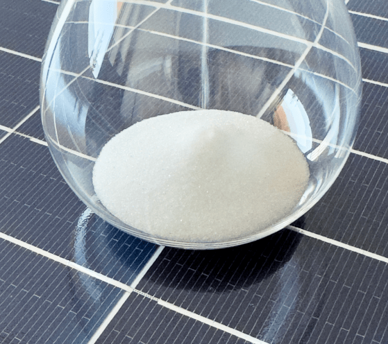 Solar panels with a beaker containing perovskite on top