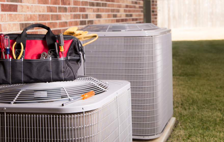 two HVAC next to house