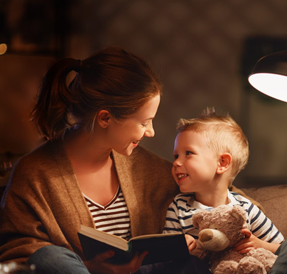 a mom and a son reading a book